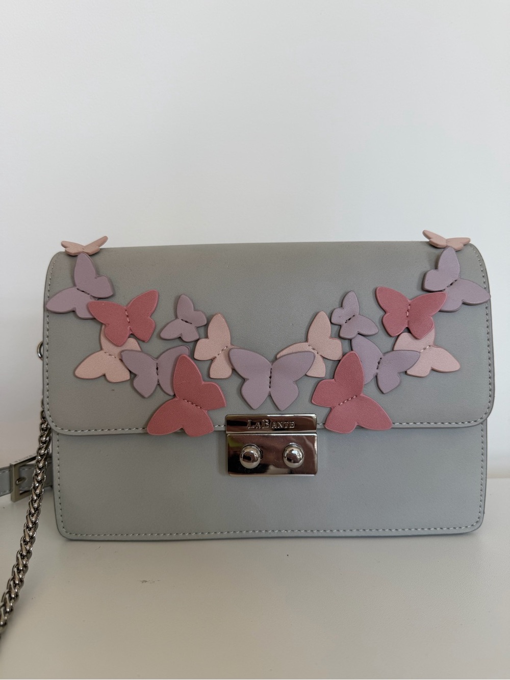 Eco-friendly Leatherette Butterfly Crossbody Bag in Light Gray and Pink $75